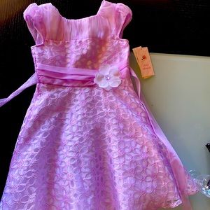 A purple formal dress with a pretty sparkle flower